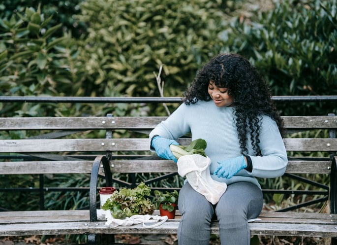 Gardener caring for plants outdoors